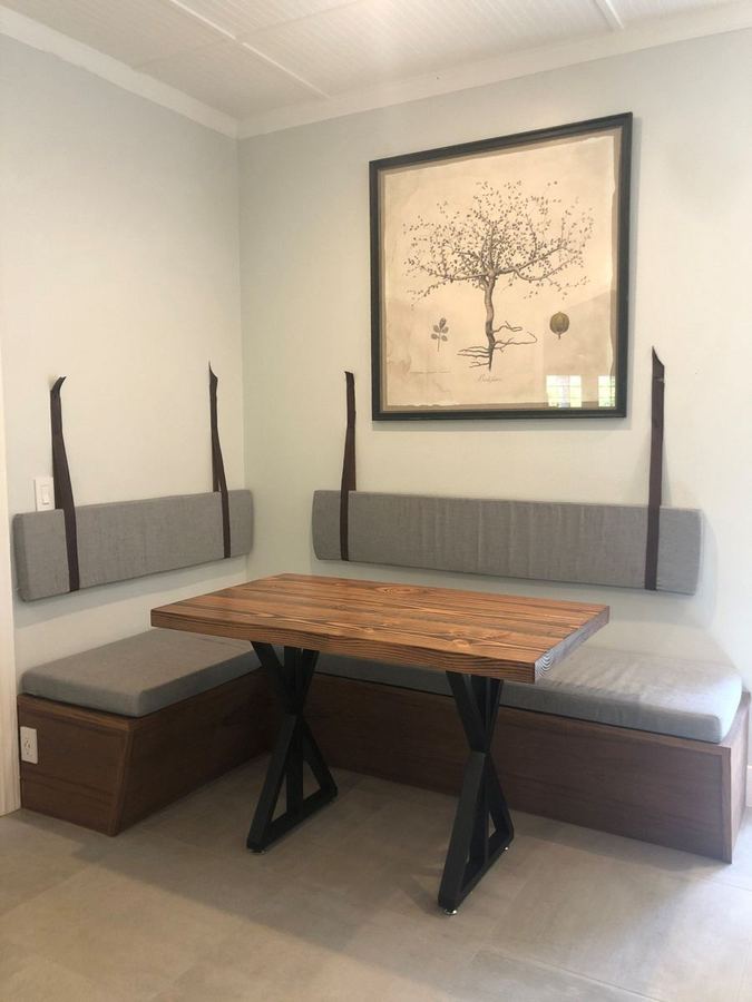 Built-in banquette bench with a wood-top table